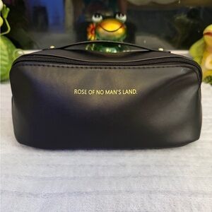 Woman’s makeup bag, OR man’s grooming and personal items kit. Comes in pink also